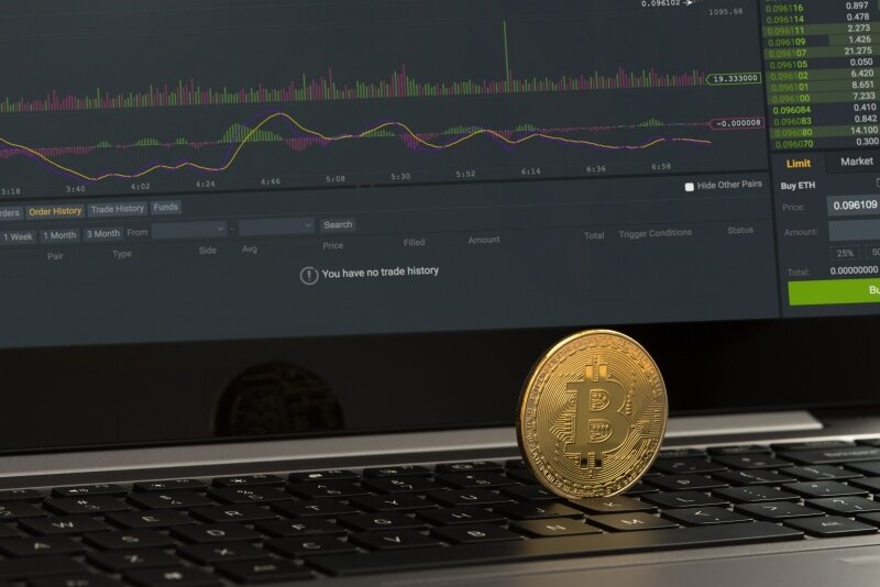 bitcoin on laptop keyboard